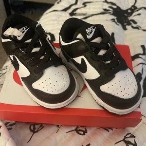 Black and white toddler Nike dunks. Hard bottom.